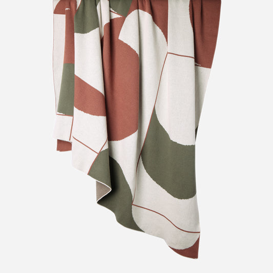 Folded Abstract 100% cotton knitted throw in Ecru/Rust Diwali/Green Diwali