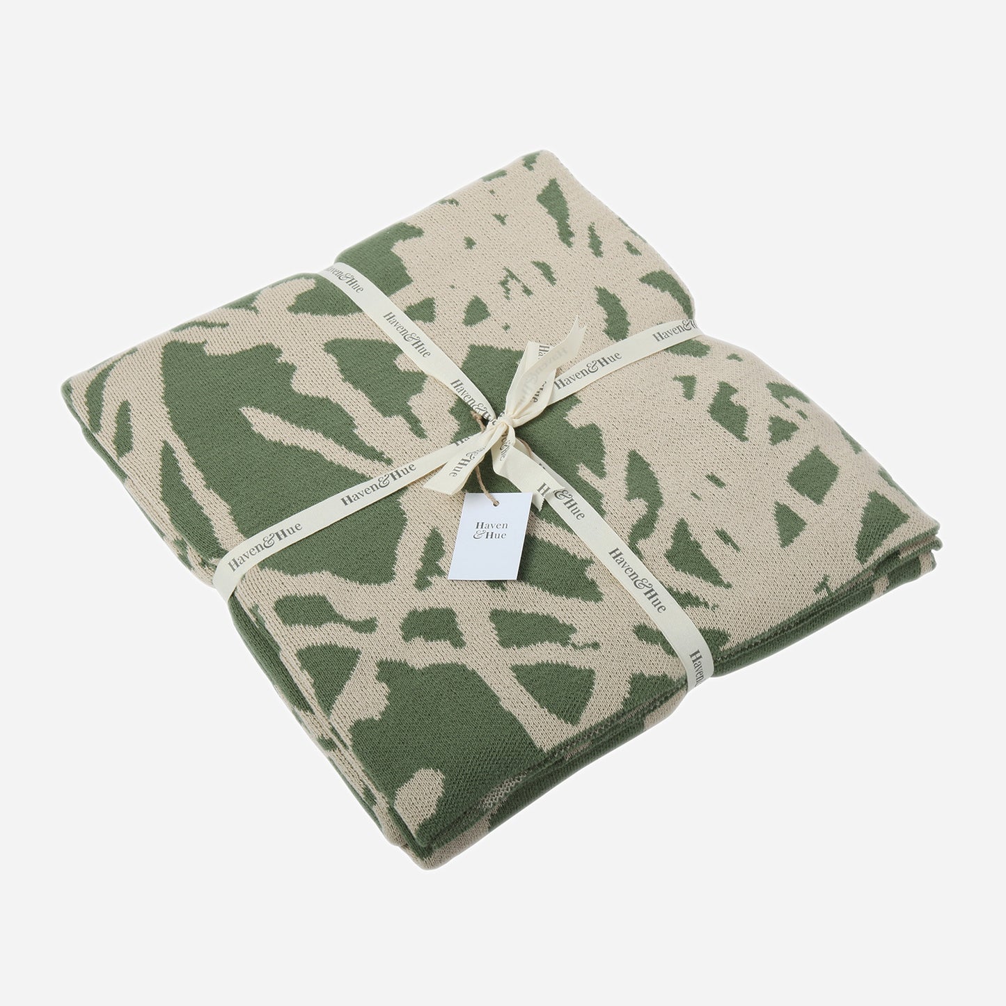 Folded Branches 100% cotton knitted throw in Green / Oat with ribbon detail