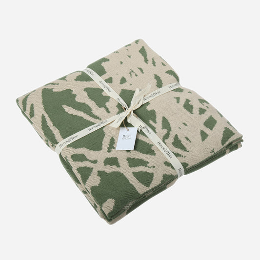 Folded Branches 100% cotton knitted throw in Green / Oat with ribbon detail