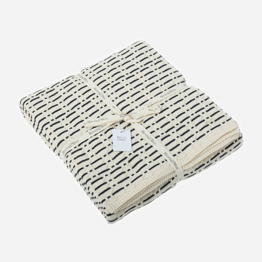 Folded Interwoven 100% cotton knitted throw in Indigo / Ecru with ribbon detail