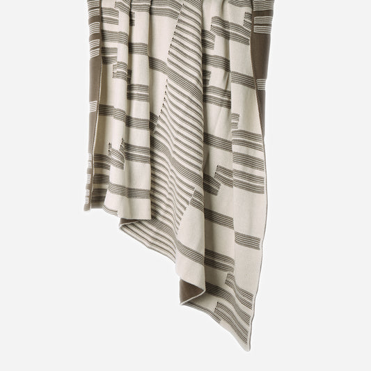 Hanging Linear 100% cotton knitted throw in Olive Tosil / Ecru showing reversible sides