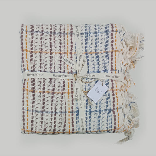 Folded Multi Stripe 100% cotton woven throw in Blue / Orange / Ecru with ribbon detail