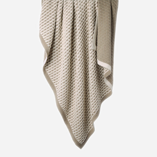 Hanging Scallops 100% cotton knitted throw in Natural Melange / Ecru showing reversible sides