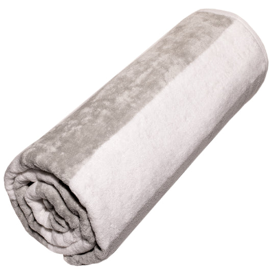 Rolled-up gray and white velour towel on a white background