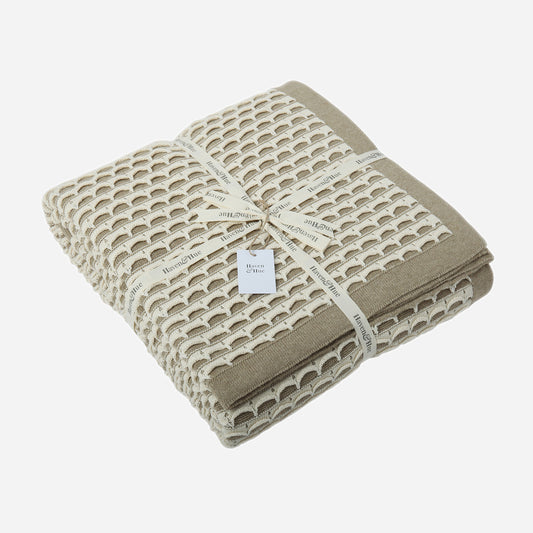 Folded Scallops 100% cotton knitted throw in Natural Melange / Ecru with ribbon detail